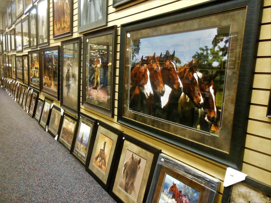 Wall to wall western-themed prints.