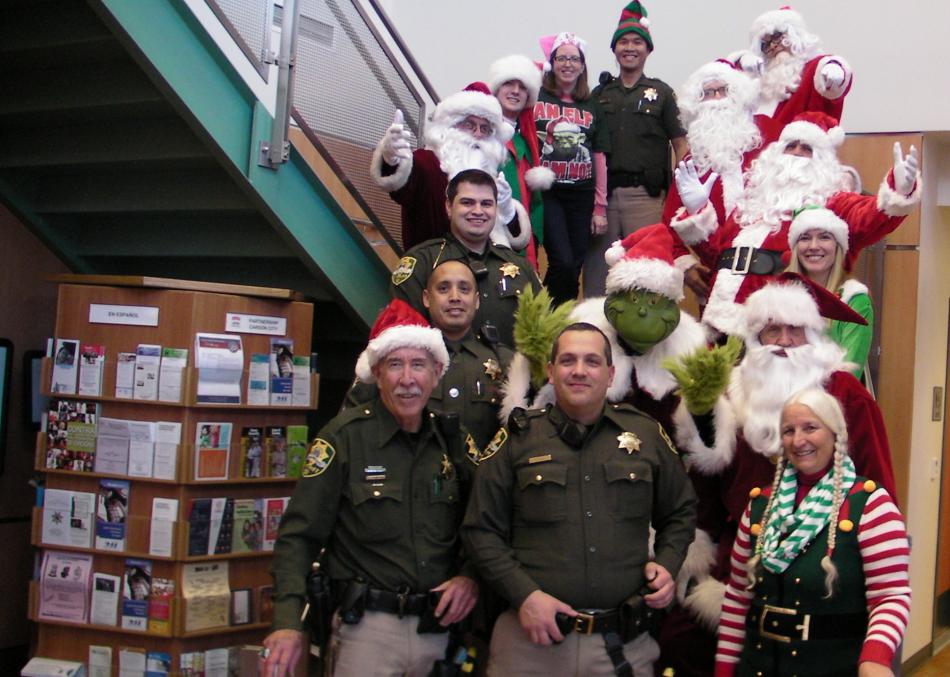 The crew of Christmas Eve volunteers meet at the Carson City Sheriff's Office.