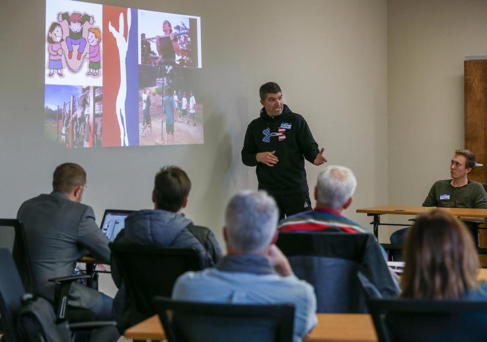 Western Nevada College student Nathan Johnston presents a marketing plan to local business leaders at Adams Hub on Dec. 8.