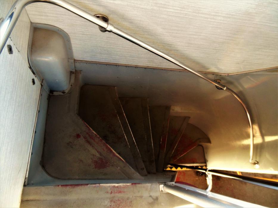 Stairwell leading from the main deck to the upper deck.