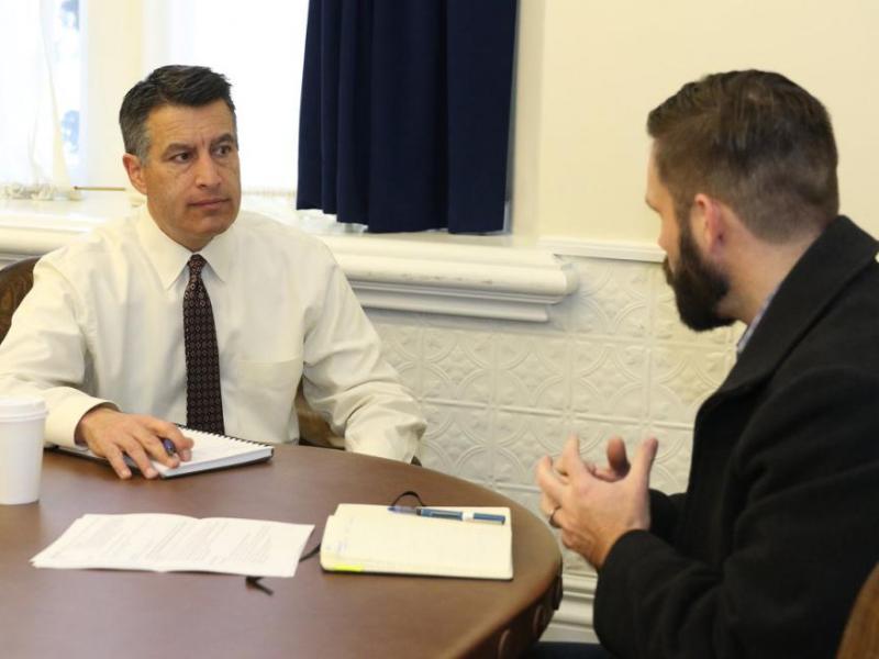 Nevada Gov. Brian Sandoval receives a briefing from emergency managers Friday.