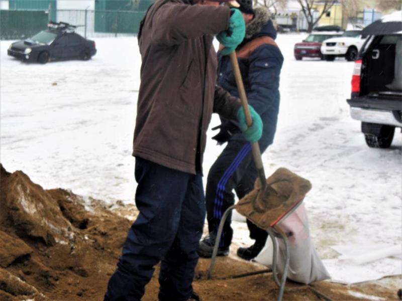Photos by Brett Fisher. Residents fill sand bags at the Carson City Public Works yard on Butti Way Saturday.