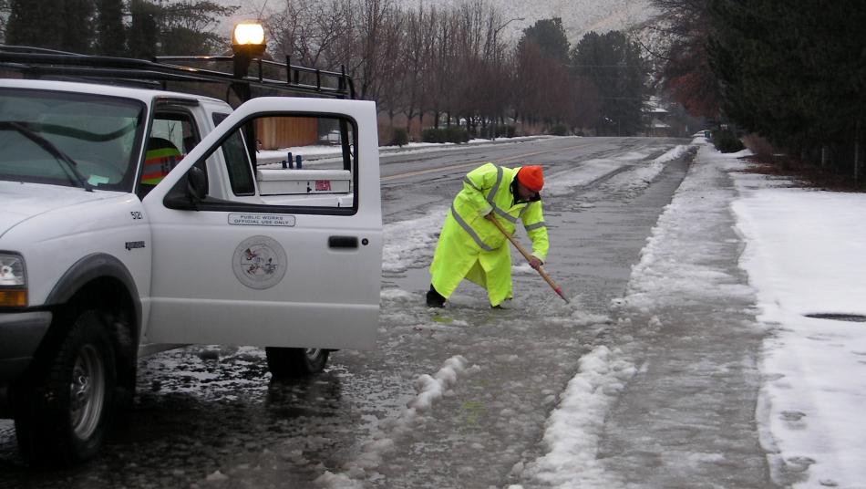 Tom Gordon of Carson City Public Works unclogs drainages.