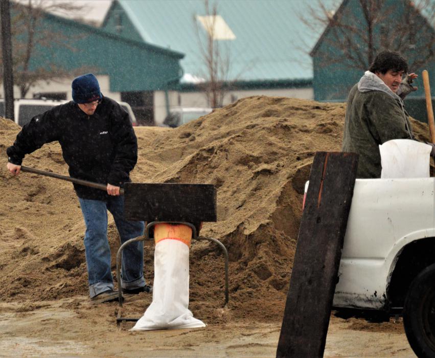 Filling sand bags at the public works yard on Butti Way.