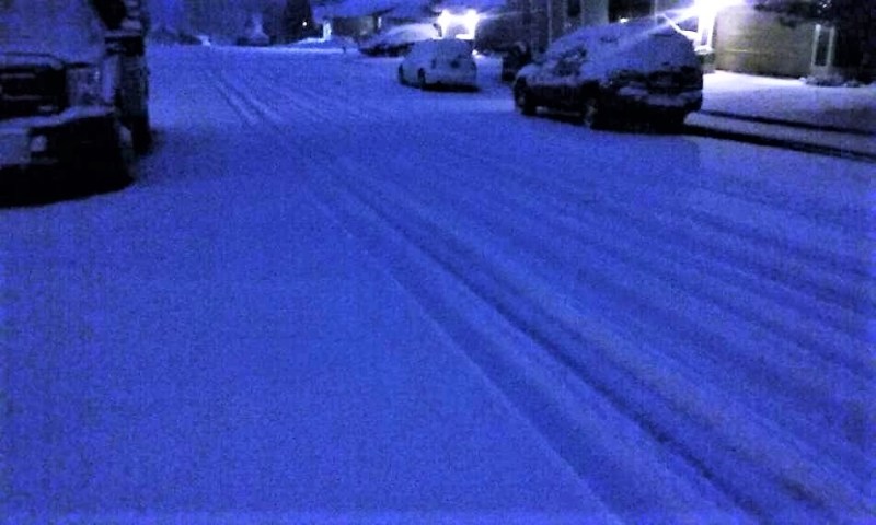 Photos by Brett Fisher. Snow blankets a residential street in East Carson City Thursday morning.