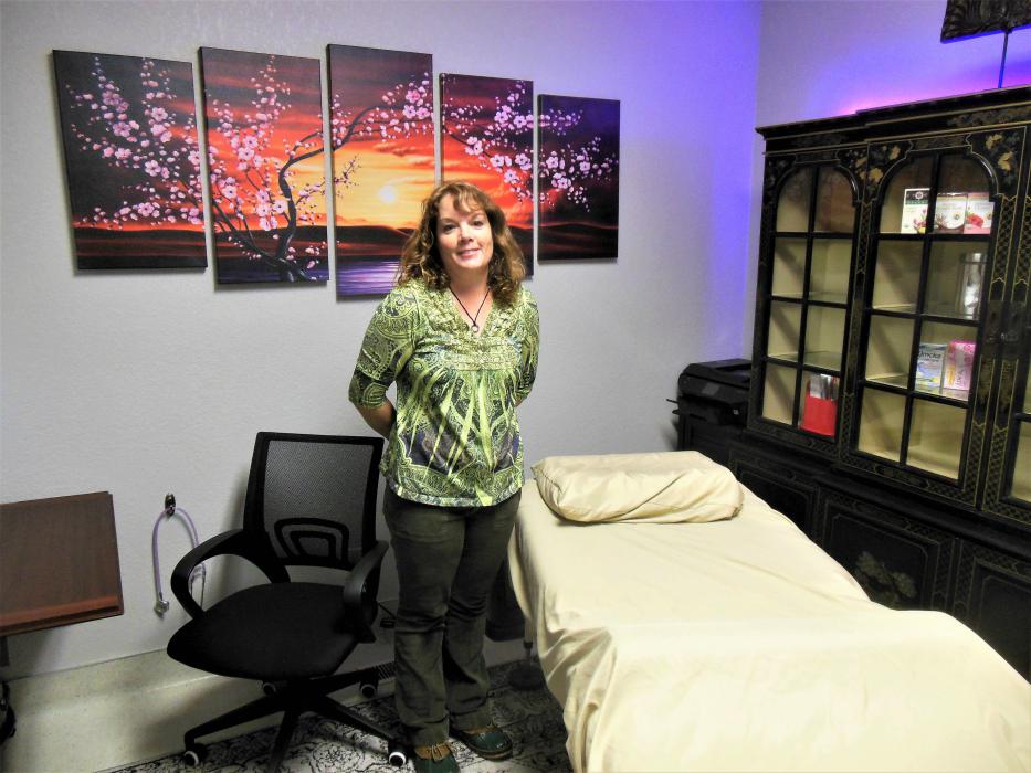 Photos by Brett Fisher. Dr. Julie Foster in her acupuncture treatment room.