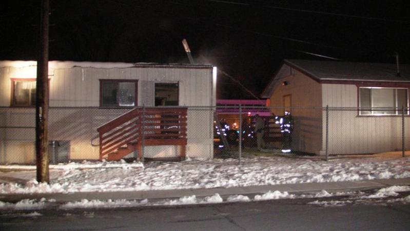 Firefighters work fire inside a portable classroom at Pioneer High.