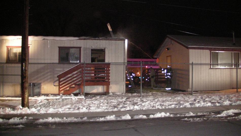 Firefighters work fire inside a portable classroom at Pioneer High.