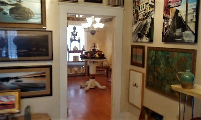 Several rooms within the new Artsy Fartsy space featuring displayed art.