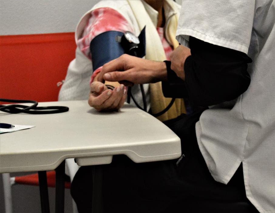 A wellness client gets her blood pressure checked Saturday at Paradise Spa.