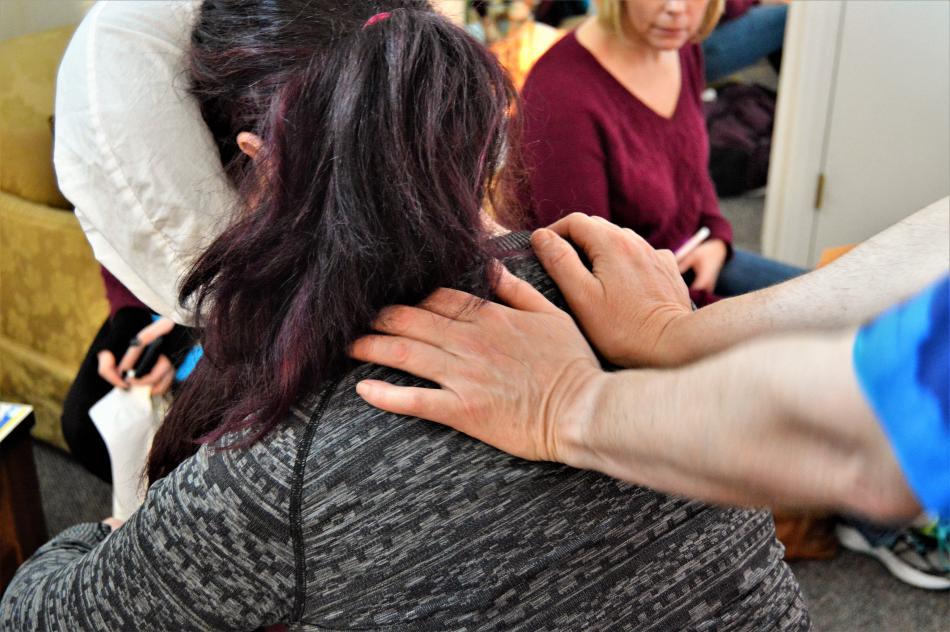 A client receives a chair massage during the wellness fair at Paradise Spa.