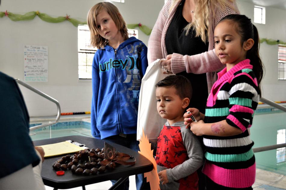 Photos by Brett Fisher. A family visits the wellness fair at Paradise Spa Saturday.