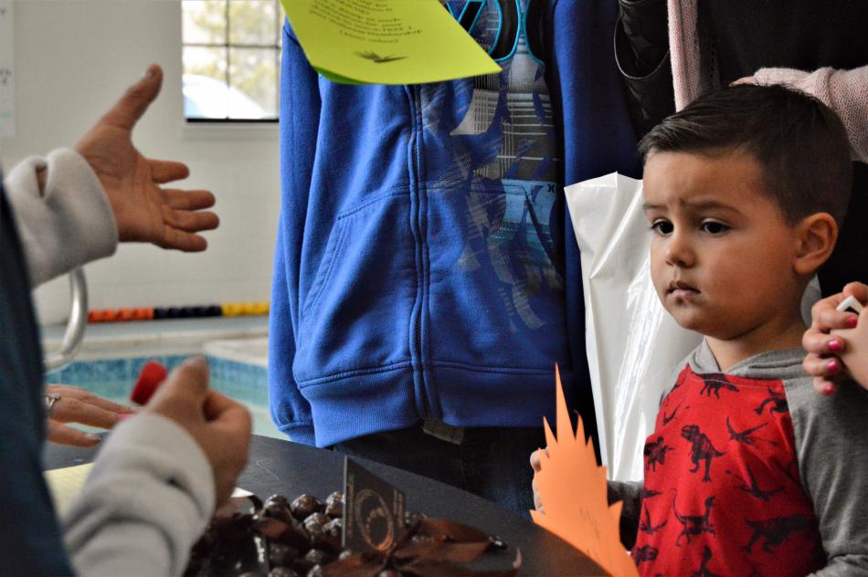 A little boy attends the wellness fair Saturday with his family.