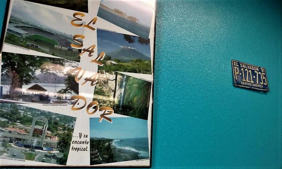 Photo by Brett Fisher. El Salvador poster and license plate.