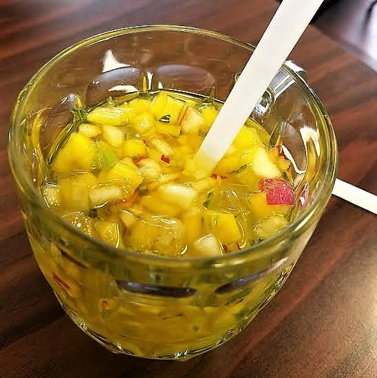 Photo by Lisa Fisher. Ensalada drink filled with chunks of fruit.