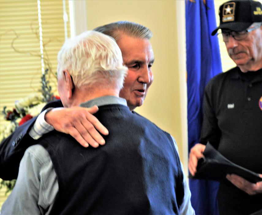Carson City Mayor Bob Crowell hugs World War II and Korean War veteran Wes Borders Wednesday.