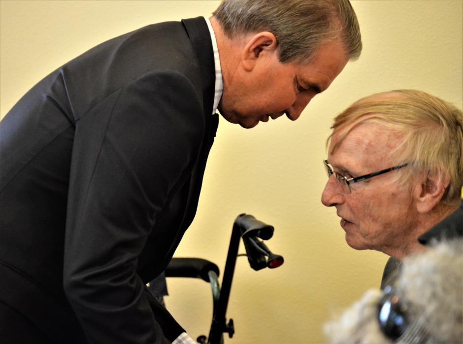 Carson City Mayor speaks with a veteran Wednesday at Sierra Place.