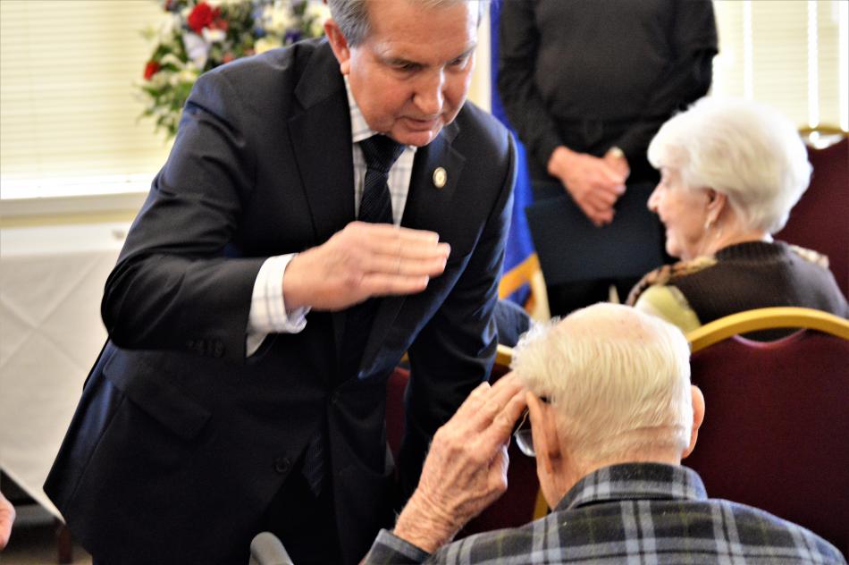 Carson City Mayor Bob Crowell salutes a veteran Wednesday at Sierra Place.