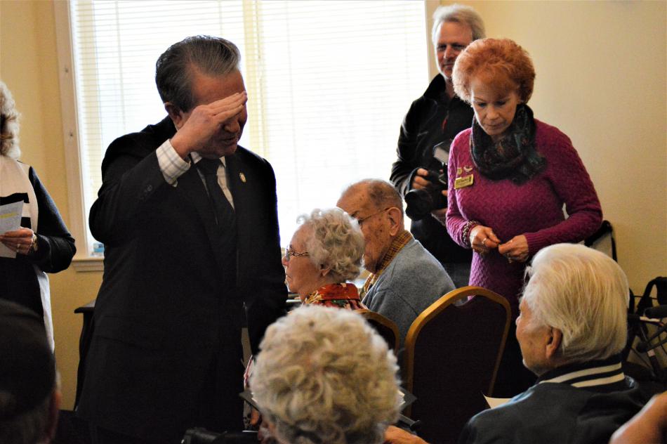 Carson City Mayor Bob Crowell salutes a veteran Wednesday at Sierra Place.