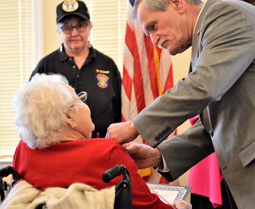 Phyllis Bendure receives a service pin from the NVDS Wednesday.