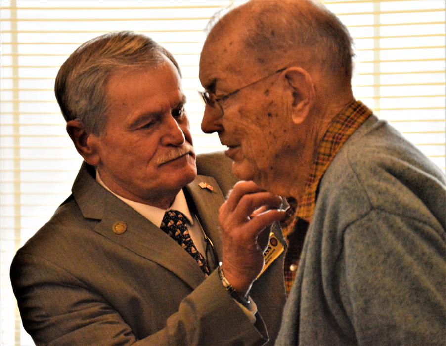 A veteran receives a service pin from the NDVS Wednesday at Sierra Place.