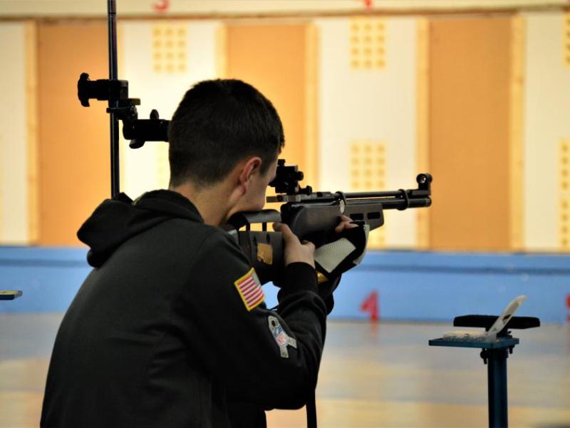 Photos by Brett Fisher. A CHS NJROTC junior varsity shooter competes Friday.