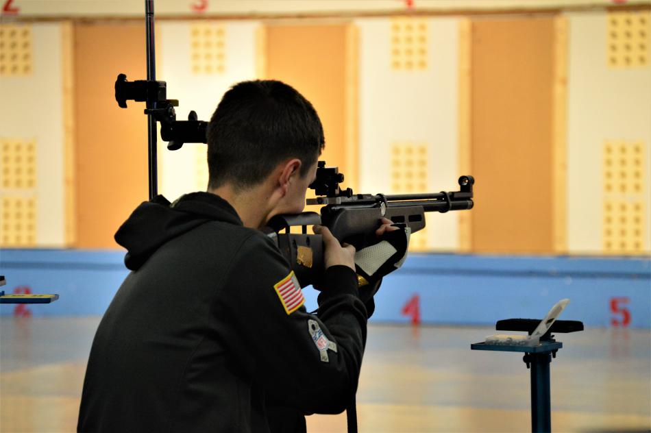 Photos by Brett Fisher. A CHS NJROTC junior varsity shooter competes Friday.