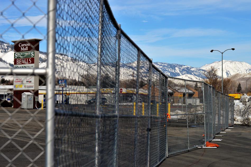 Chain link fencing on the Carson Mall property where a new annex will be built.
