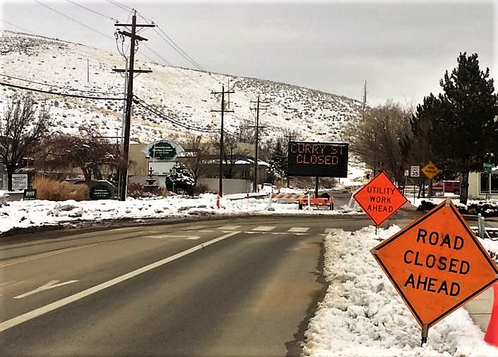 Photo by Arianna Schmidt. South Curry Street at Rhodes with flood diversion still in place.