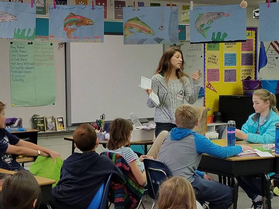 Muskin teaching Fritsch Elementary 5th Graders how to measure water quality for Trout in the Classroom programming