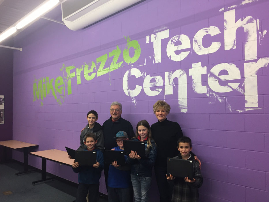 Mike Frezzo and wife Lori with kids at the Mike Frezzo Tech Center.