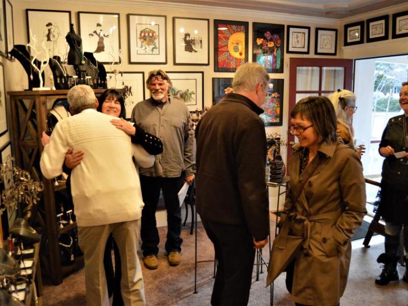Photos by Lisa Fisher. Jeffery Pace (far left) greets guests at the new Artsy Fartsy Art Gallery.