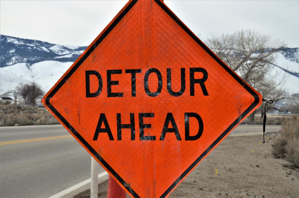 A detour flag along E. Fifth Street near Airport Rd.