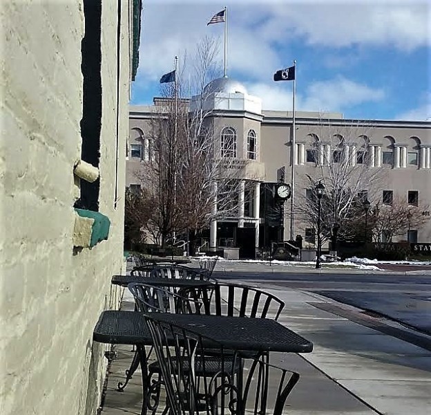 Photos by Brett Fisher. Bistro tables and chairs face the Legislature along Second St.