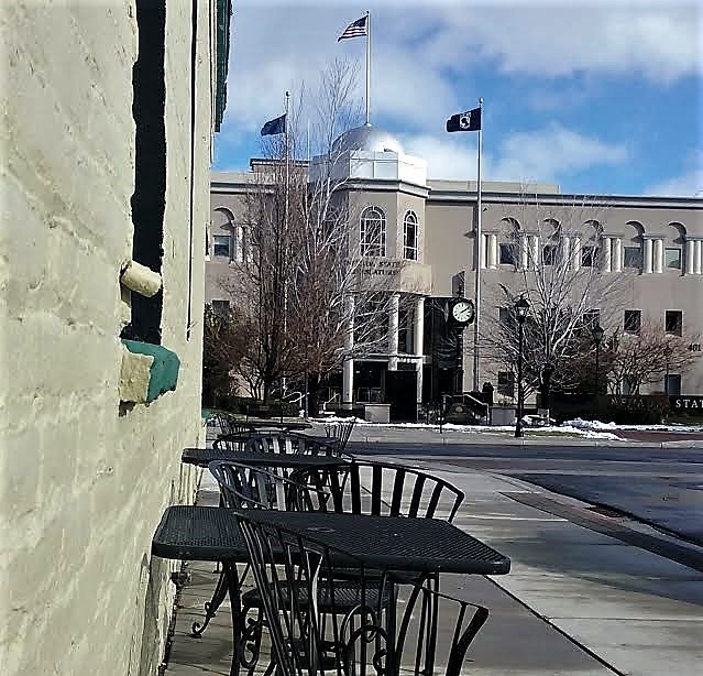 Photos by Brett Fisher. Bistro tables and chairs face the Legislature along Second St.