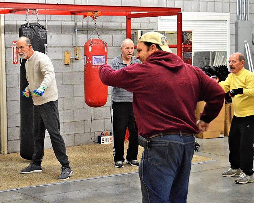 The author participating in calisthenics during a Rock Steady work-out.