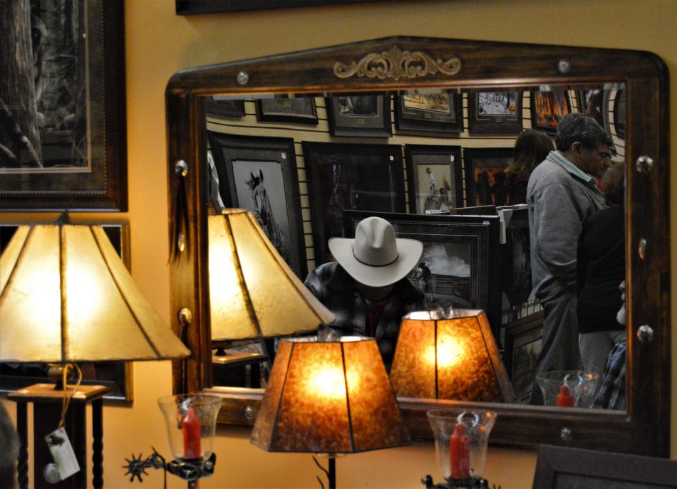 Handmade Bill Eisele lamps flank a mirror at the Wild Horse Gallery Wednesday.