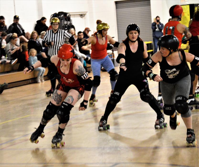 In pursuit of a jammer who is attempting to score.