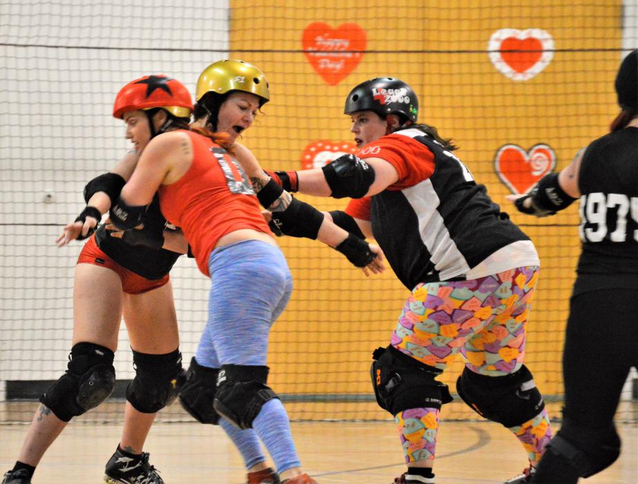 Skaters create contact on their way around the track Sunday night at the Carson Community Center.