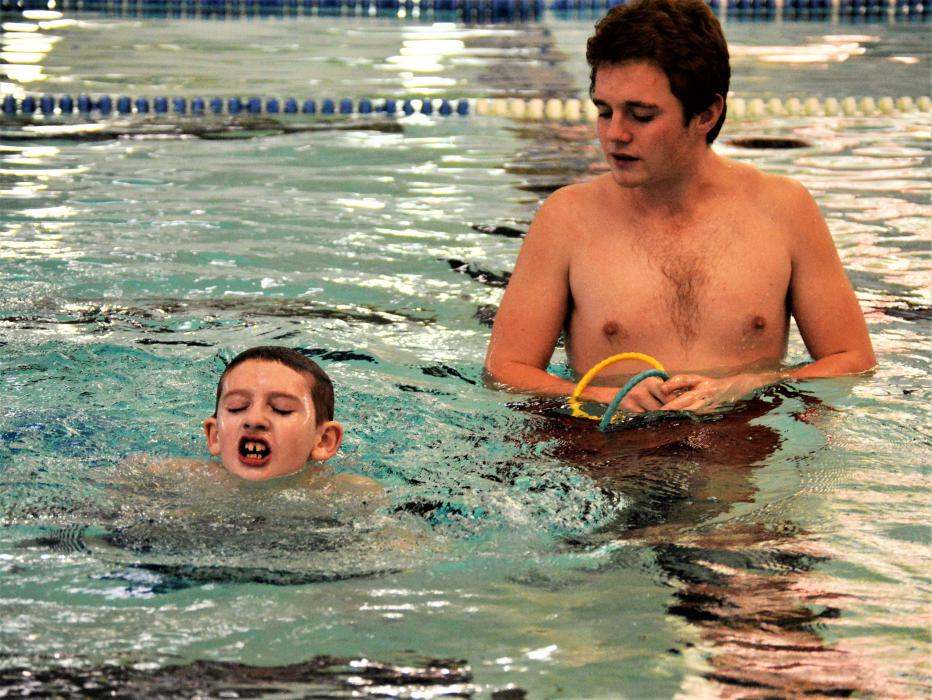 Sam Chenin (left) with instructor Miles Bean at the Carson City Aquatic Facility.
