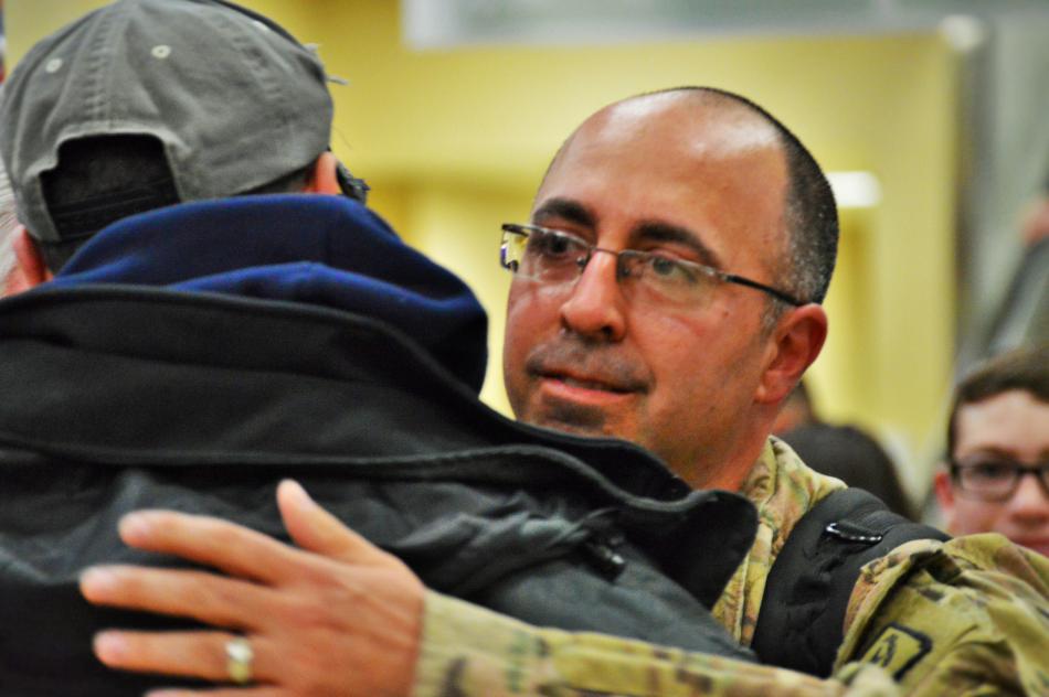 Robert Glass hugs his brother Friday at RTIA.