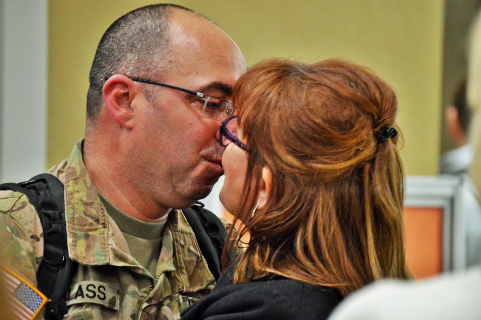 Robert and Cindy Glass kiss upon being reunited Friday afternoon at RTIA.