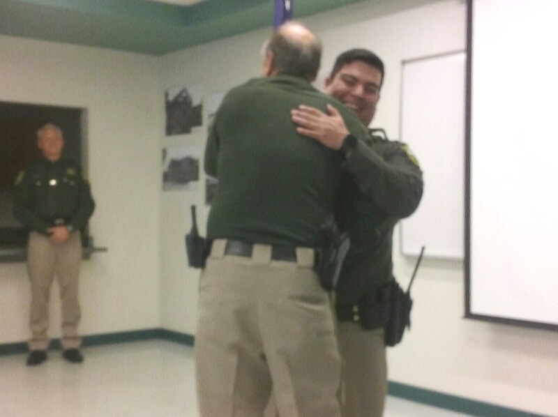 Photos by Brett Fisher. Carson City Sheriff Ken Furlong hugs new reservist Jaime Carillo.