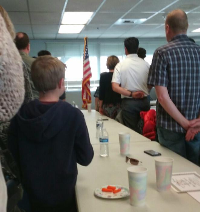 FRA luncheon guests stand for the Pledge of Allegiance.