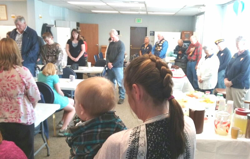 FRA luncheon guests now their heads for the invocation.