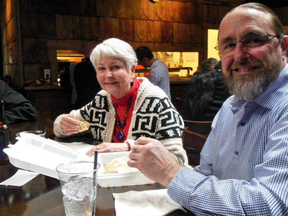 A couple enjoys their Penguin tacos Tuesday at the Westside Pour House.