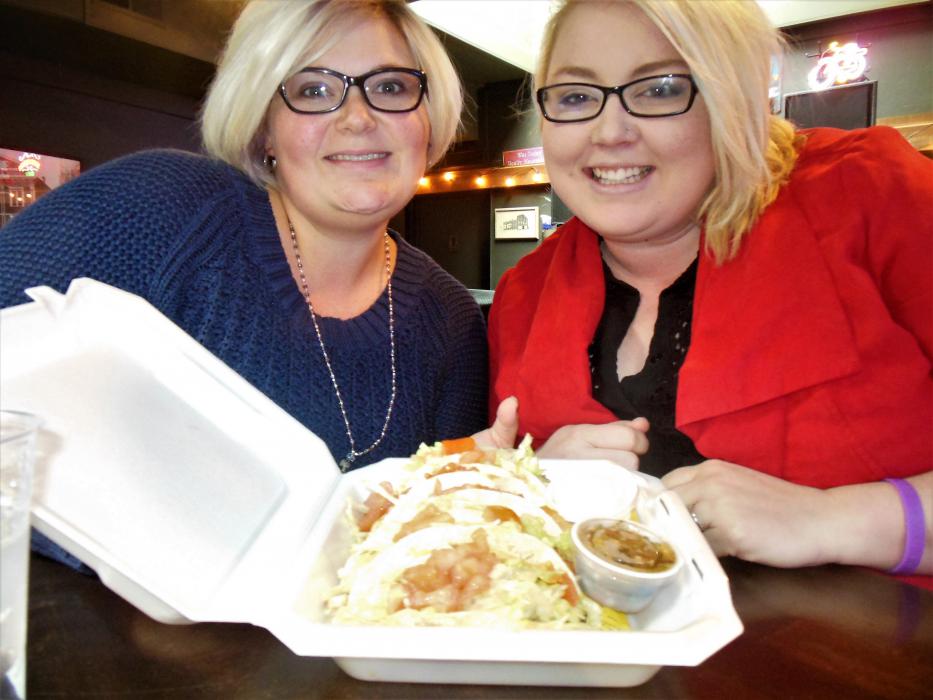 Photos by Brett Fisher. Diners at the Westside Pour House Tuesday with Penguin tacos.