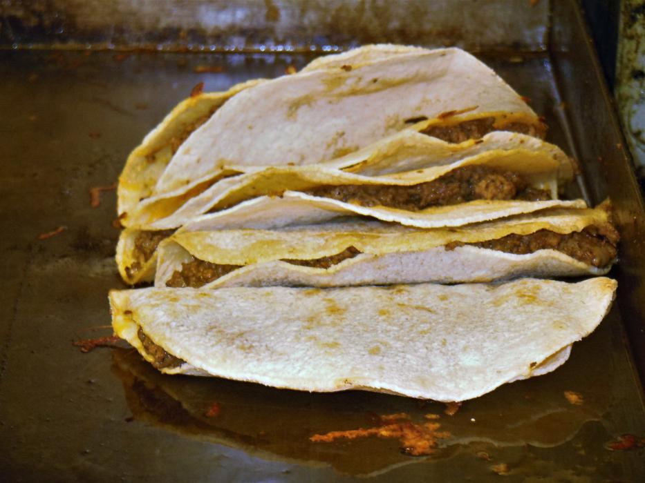 Tacos on the flat top at the Westside Pour House Tuesday.