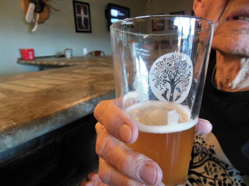 Photos by Brett Fisher. A guest drinks an American Honey Wheat Ale Friday.