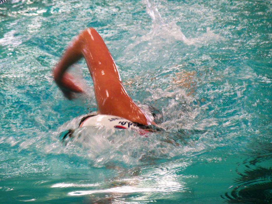A swimmer approaches the wall in short-course competition Saturday.